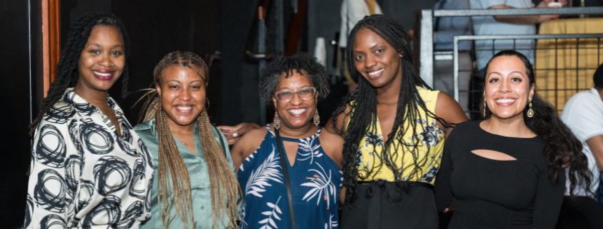 Smiling group of doctoral students at a reception